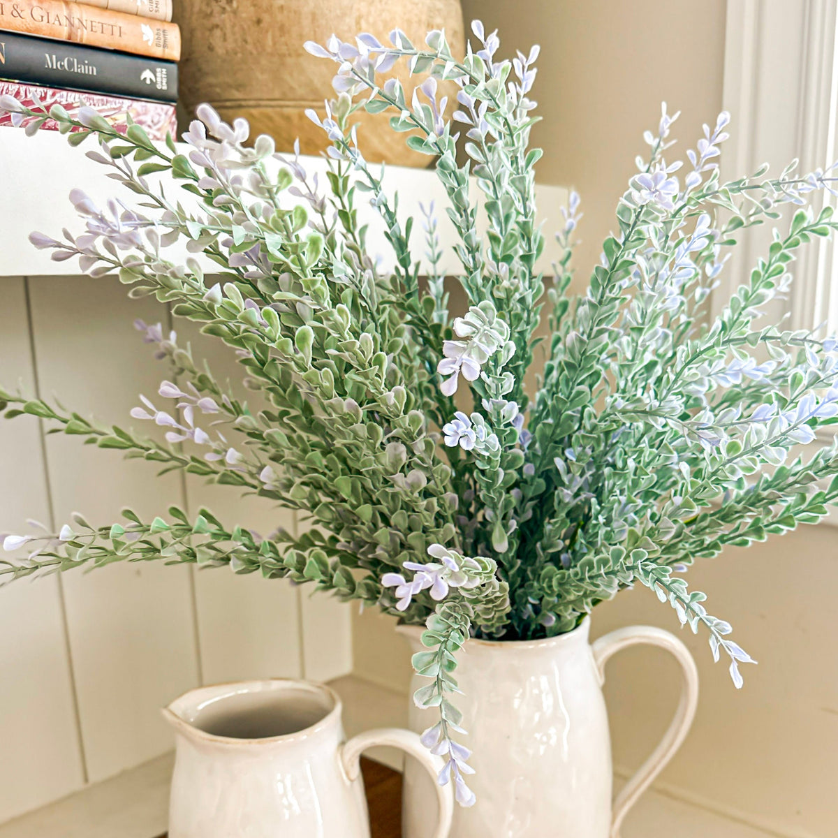 A artificial soft green plant with purple foliage bush.