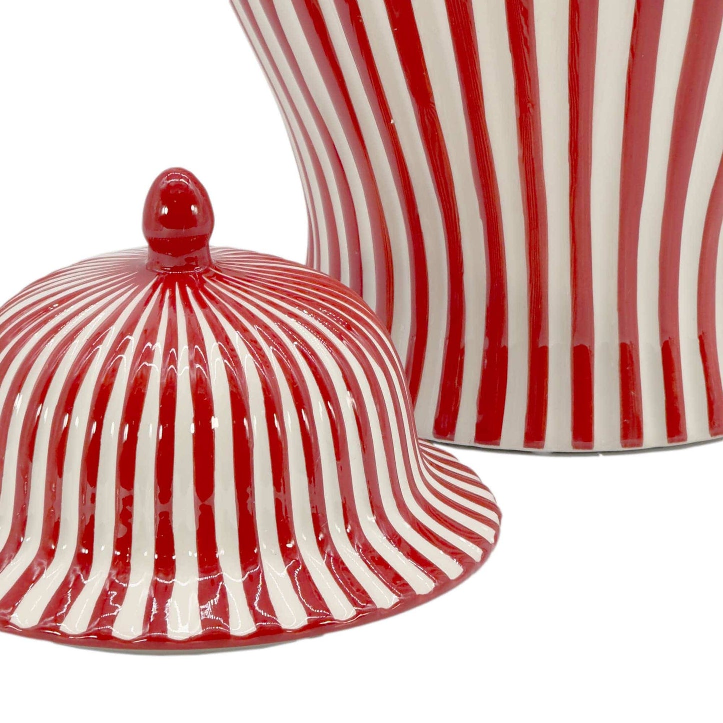 Red and white striped ceramic jar with matching lid on a white background