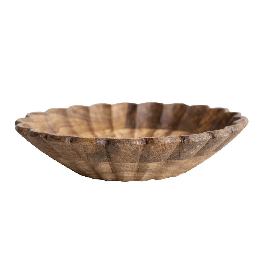 A scalloped edge mango wood bowl with a natural pattern.