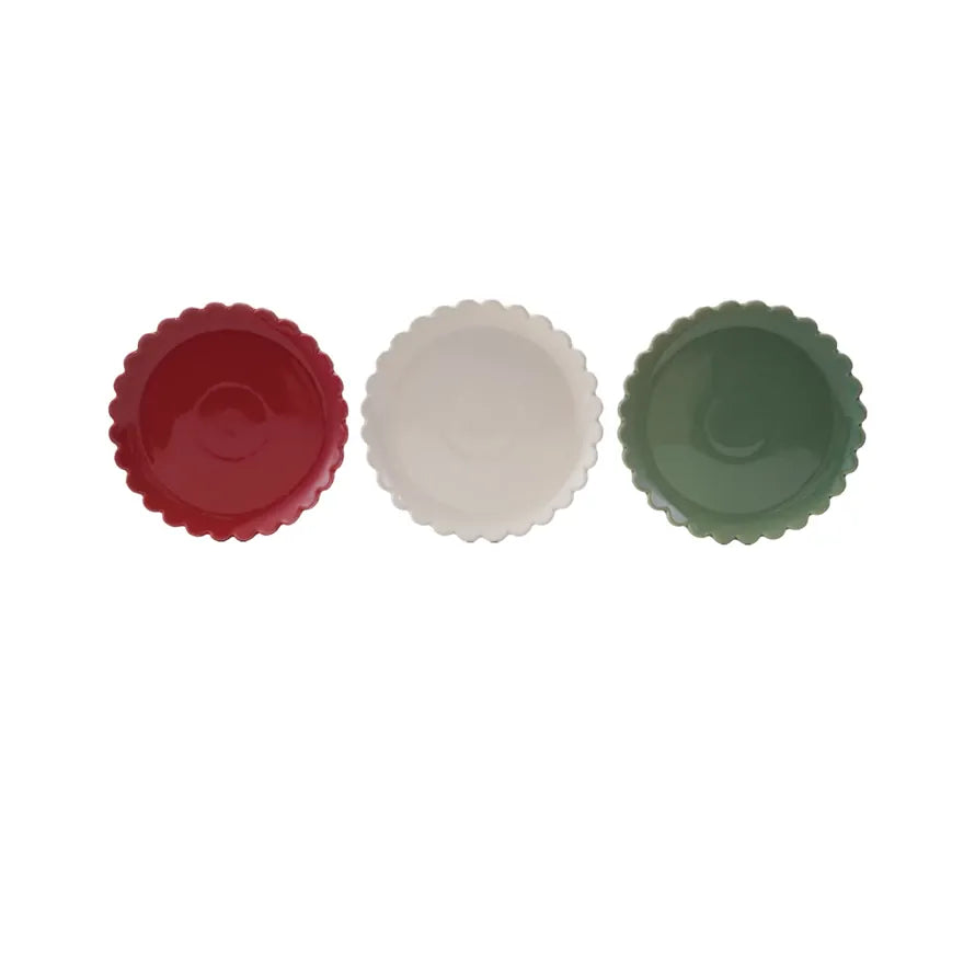 Three colorful stoneware bowls(red, white, green) on a white background