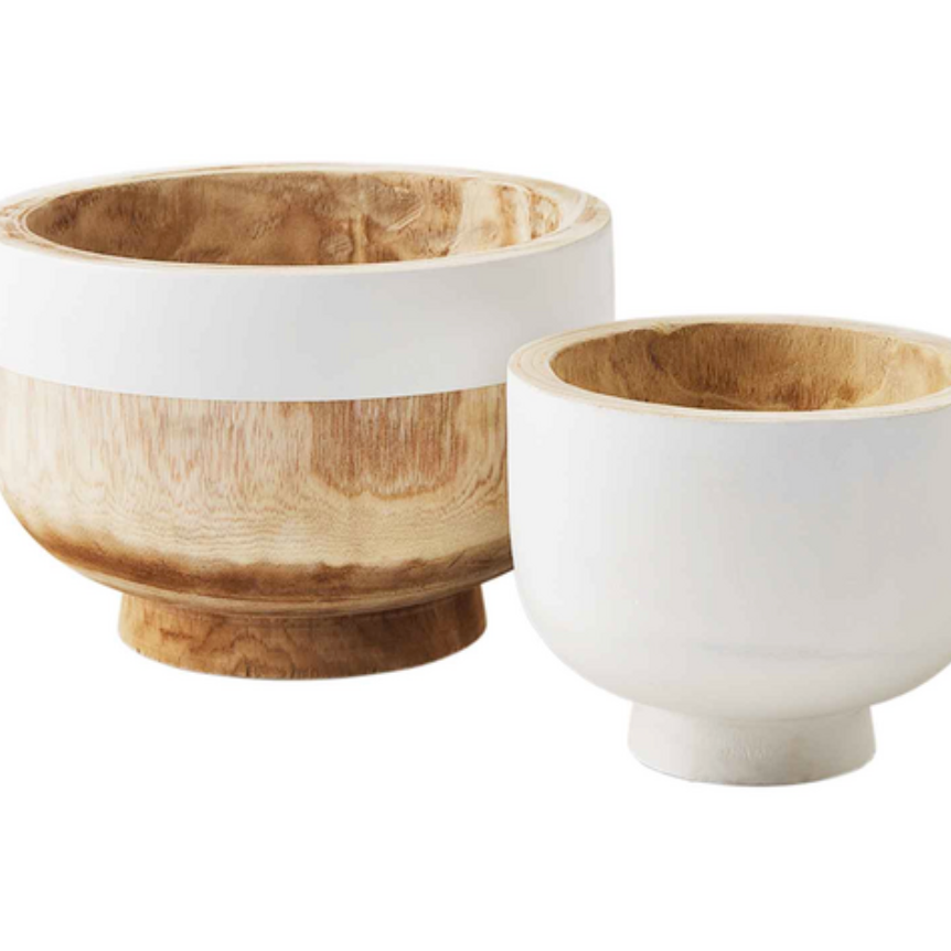 Two hand-painted paulownia wood bowls, one large and one small, with white and natural coloring, displayed on a wooden surface.