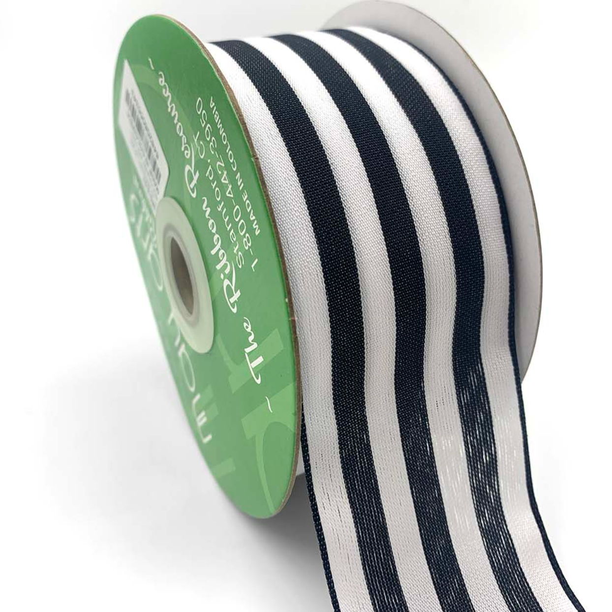A roll of black and white striped ribbon with a woven edge