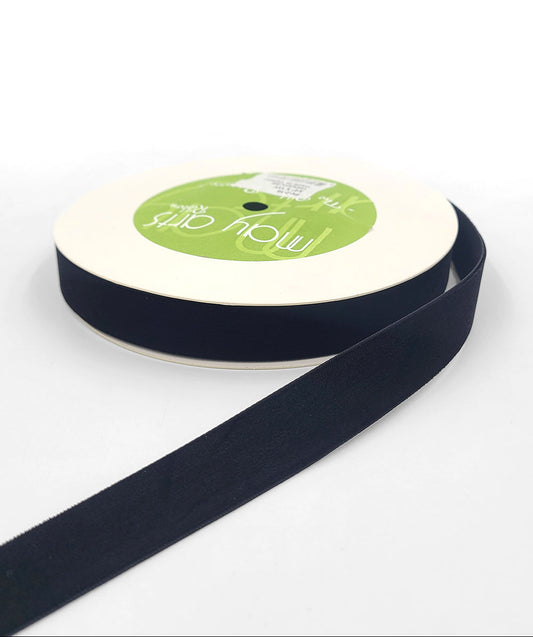 A roll of 3/4 inch velvet ribbon with a woven edge, displayed in black color.