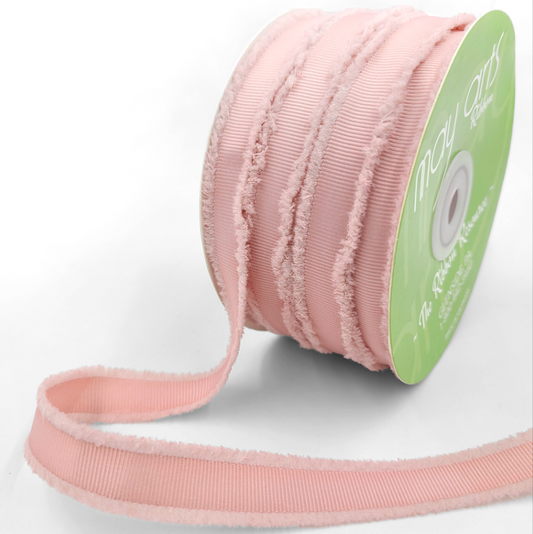 A spool of mauve-colored fuzzy grosgrain ribbon.