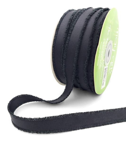 A spool of black fuzzy grosgrain ribbon.