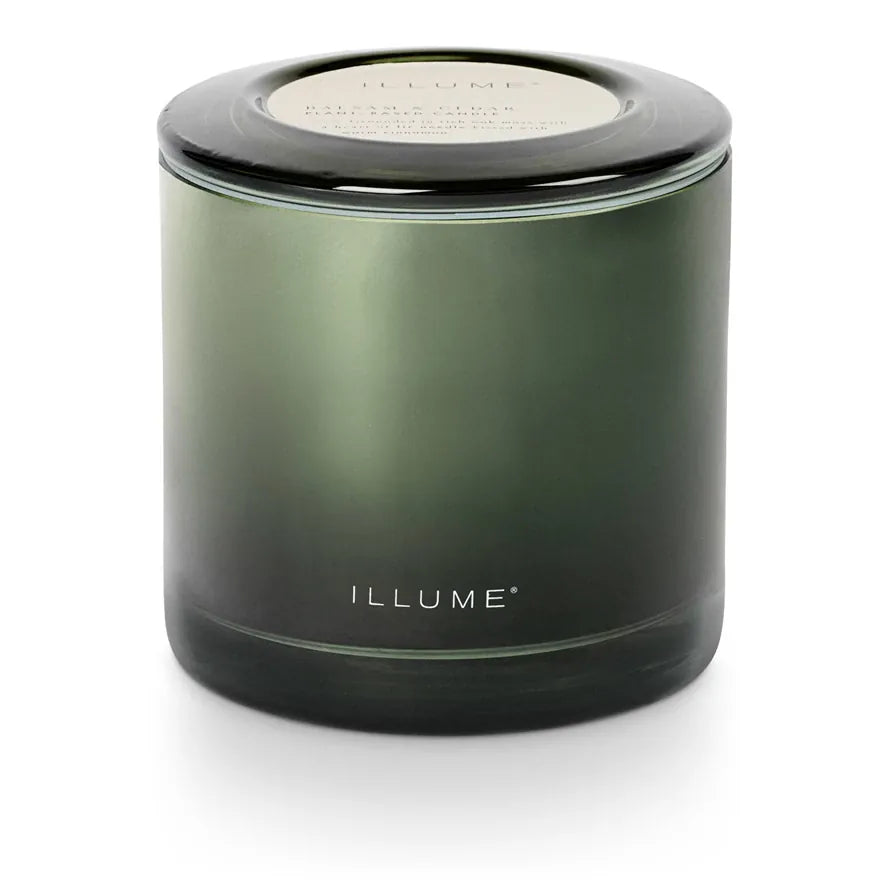 Green glass candle with black lid 