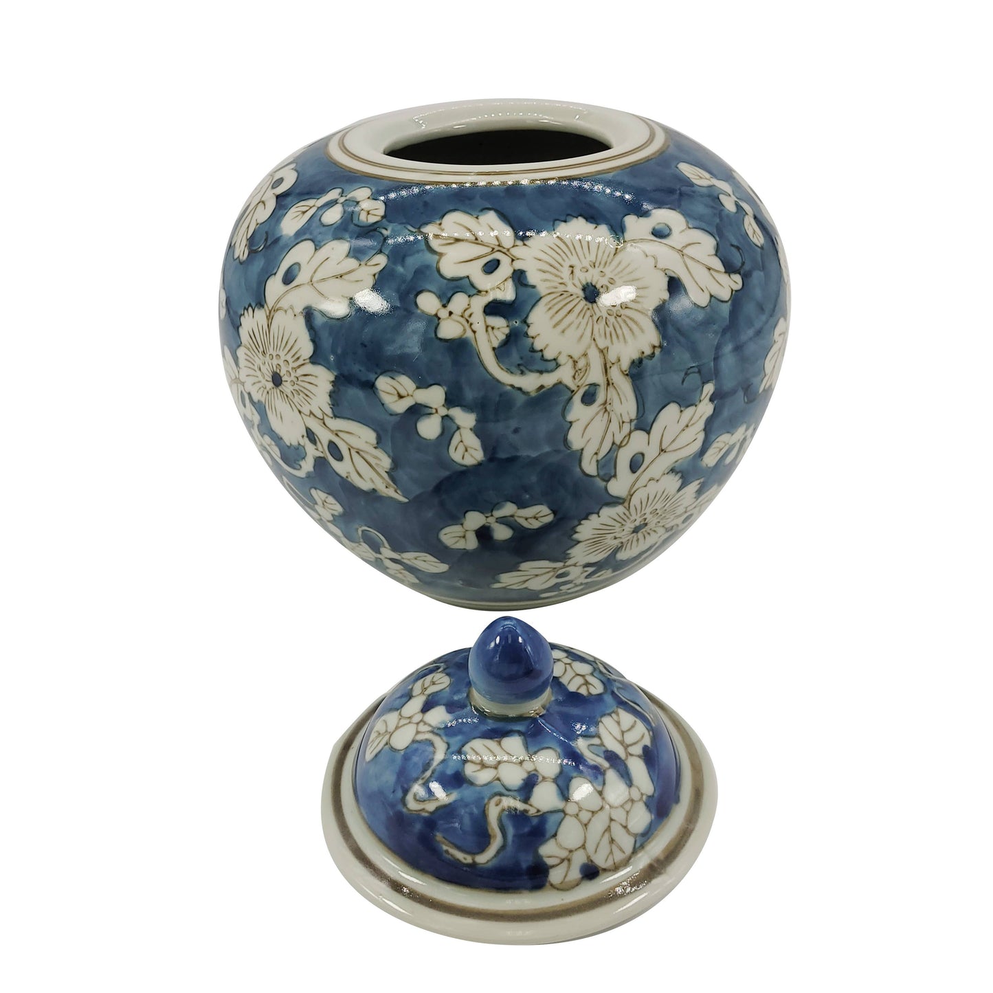 Blue ceramic jar with white floral patterns on a white background Blue & White Chinoiserie Ceramic Jar 8"