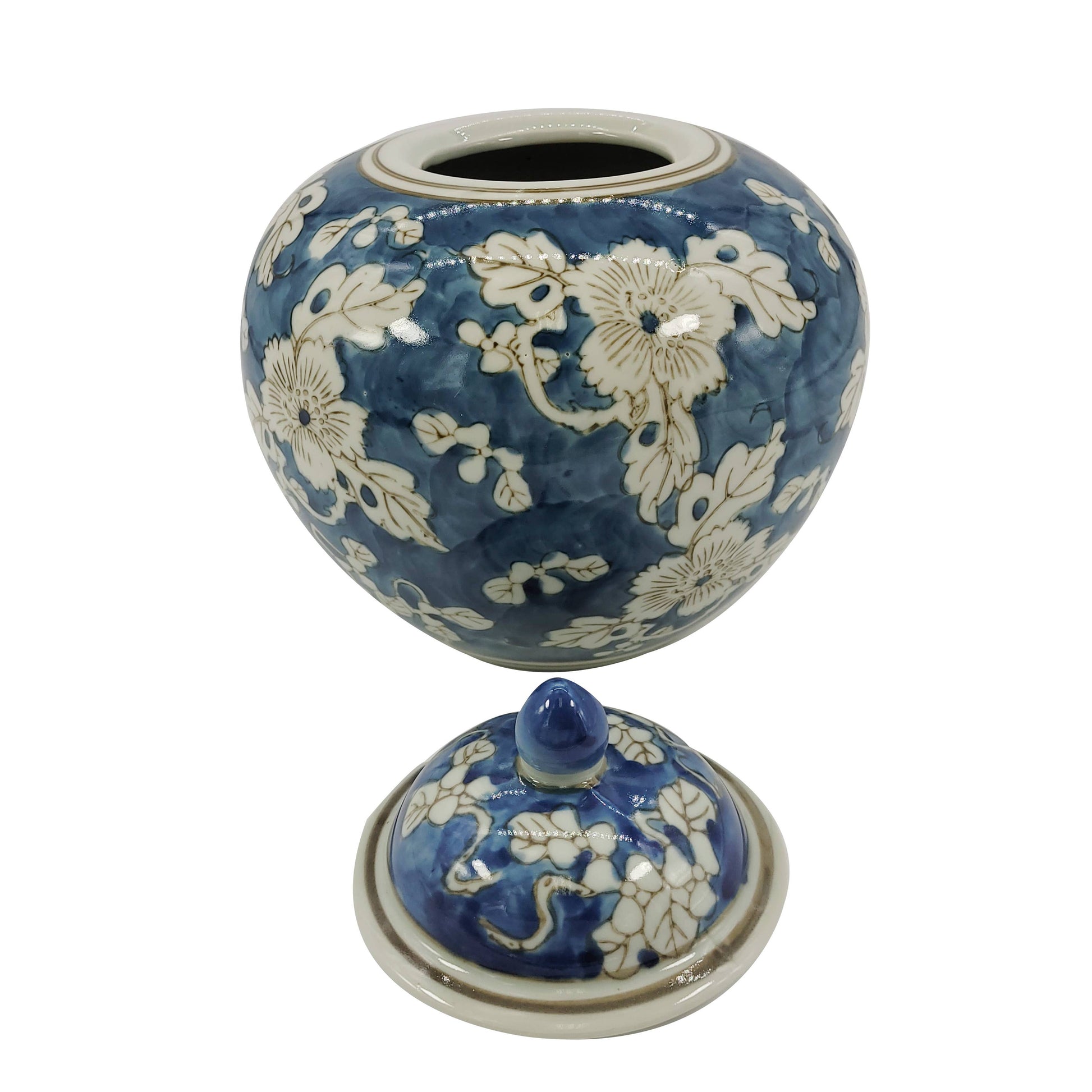Blue ceramic jar with white floral patterns on a white background Blue & White Chinoiserie Ceramic Jar 8"