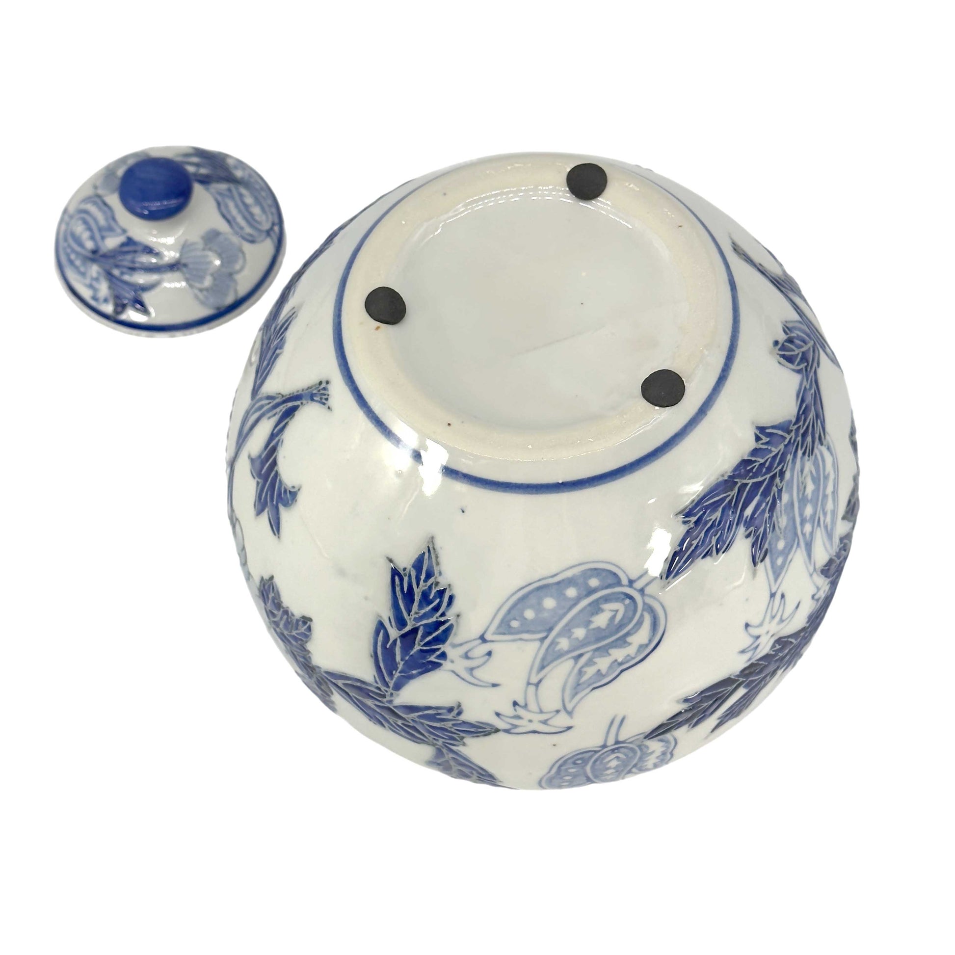 Ceramic jar with blue floral patterns on a white background
