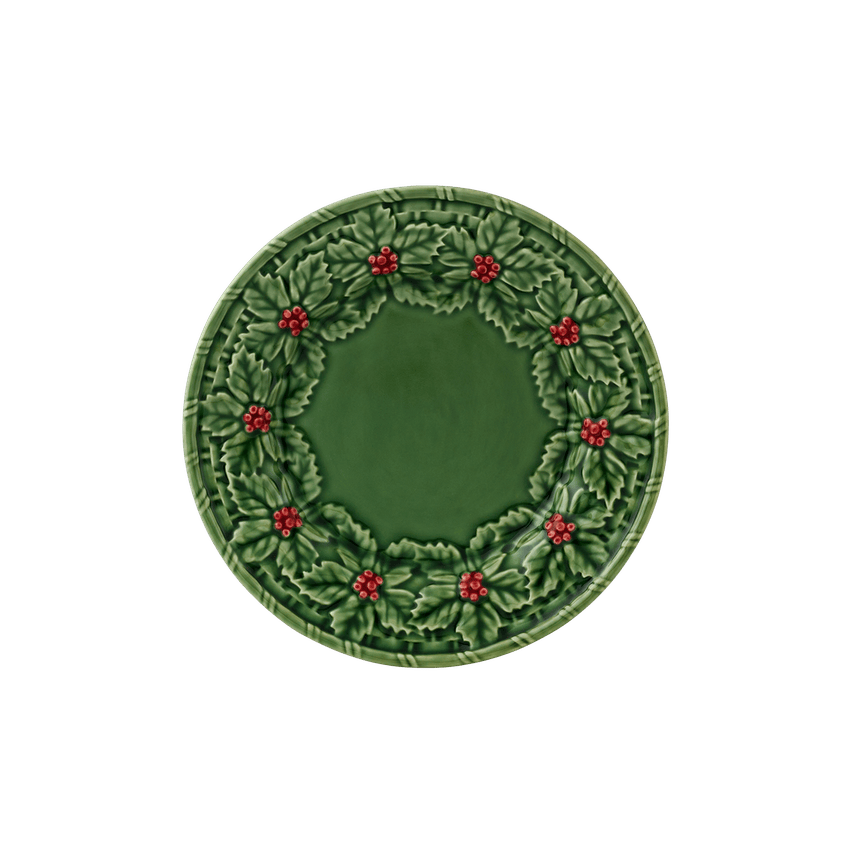 Green plate with holly design on a white background