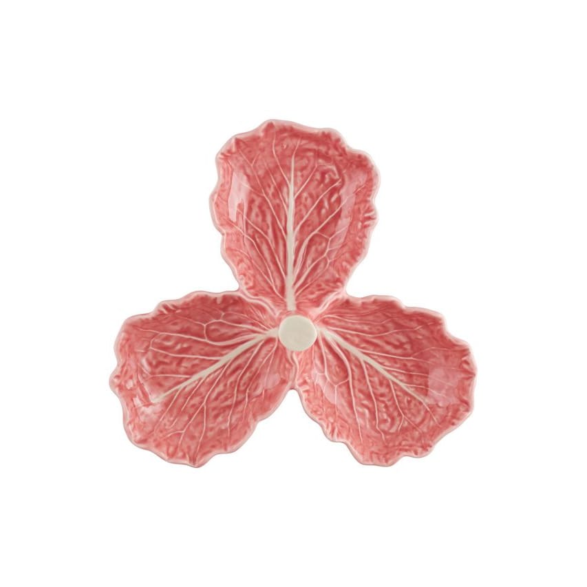 Pink ceramic leaf-shaped olive dish on a white background
