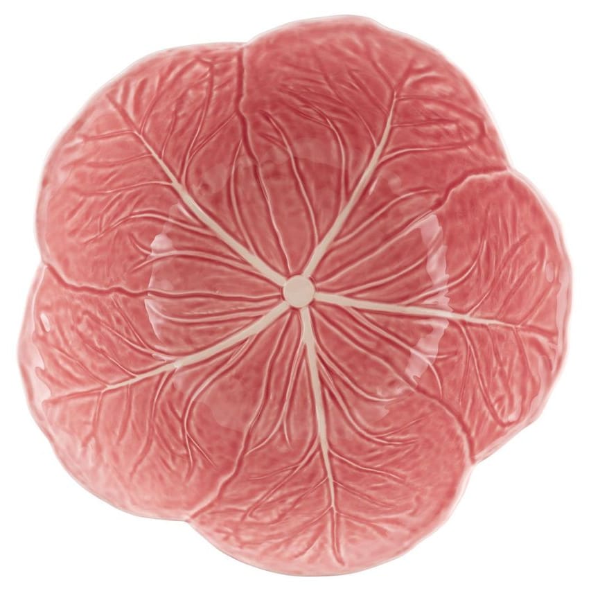 Pink ceramic plate with cabbage leaf pattern on a white background