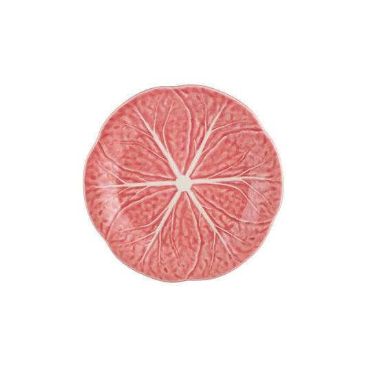 Decorative plate with pink cabbage leaf design on a checkered tablecloth