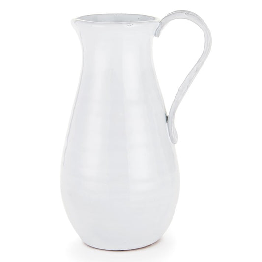 A white ceramic pitcher with a handle, isolated on a white background.