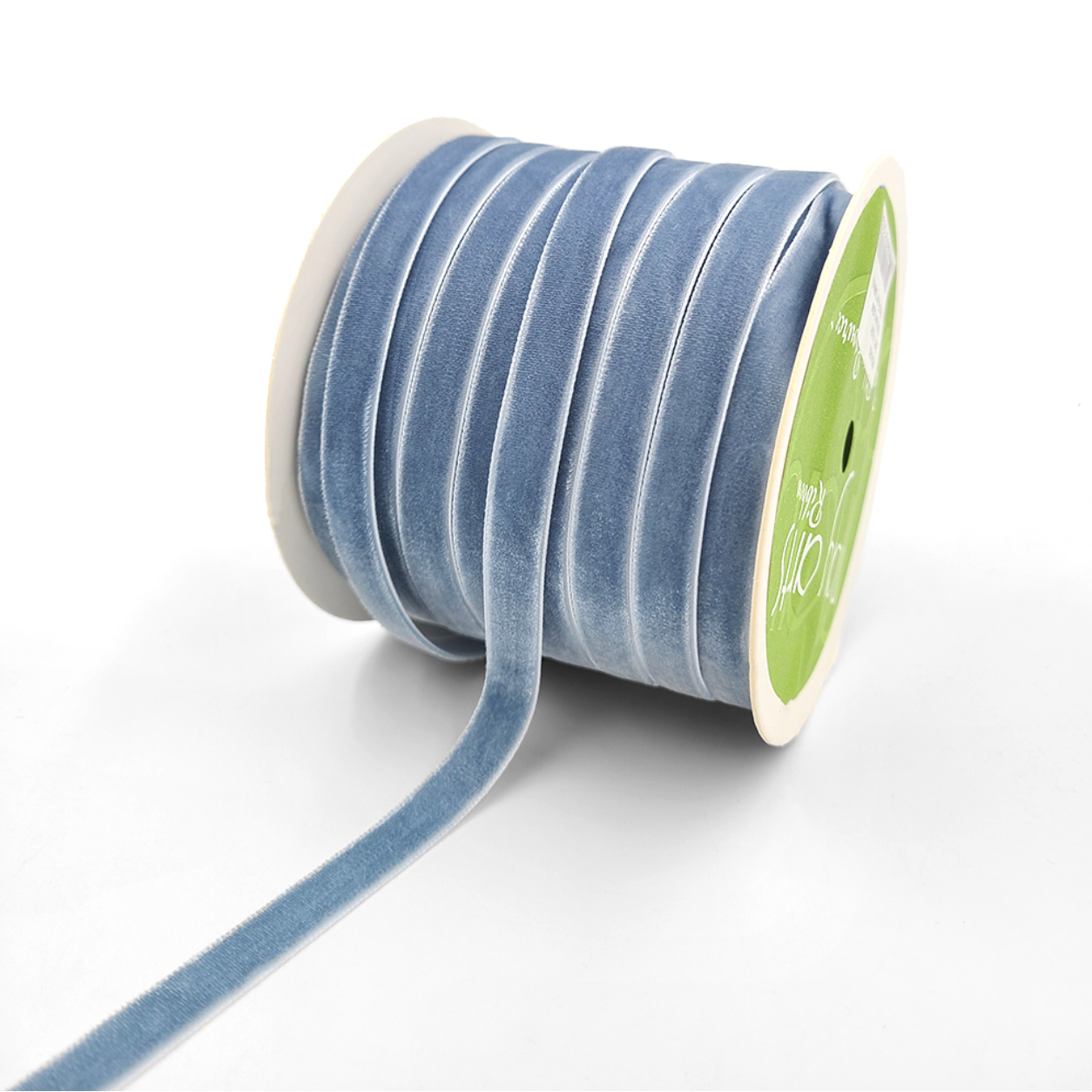 Spool of blue ribbon on a white background