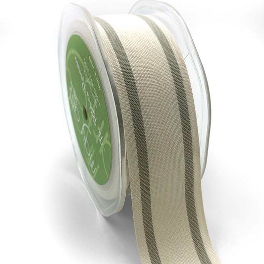 A roll of 1.5 inch wide cotton blend woven double stripe ribbon in a natural color, with a label visible on the core.