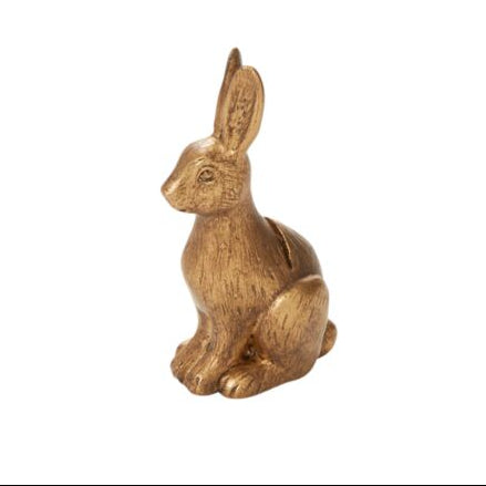 A plastic name card holder in the shape of a rabbit with an antique gold finish.