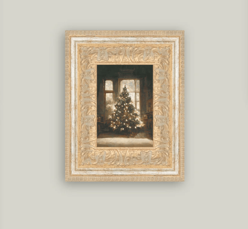 A framed vintage art piece depicting a glowing Christmas tree inside a house, with intricate gold detailing on the frame.