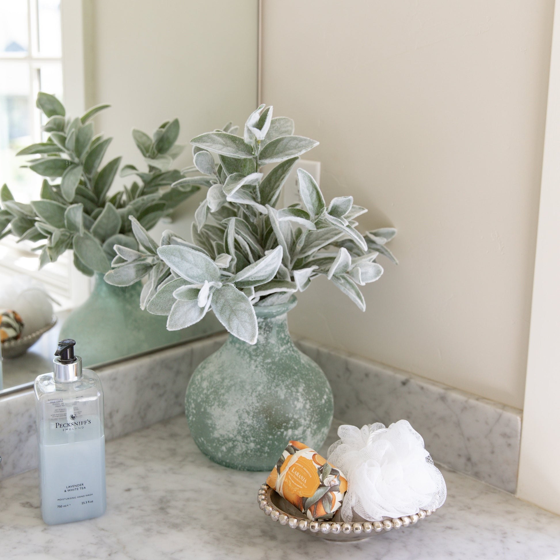 A 20-inch faux lambs ear stem with a velvety texture and a greenish hue.