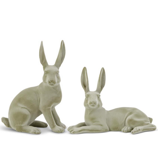 Two green velvet resin bunnies in graduated sizes, one sitting and one lying down, against a white background.