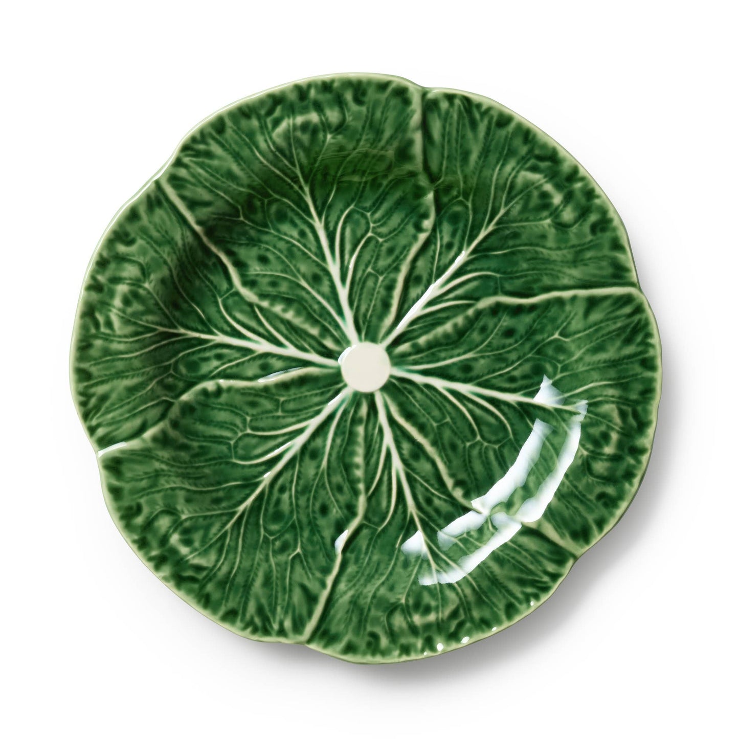 Green ceramic plate with cabbage leaf design on a white background
