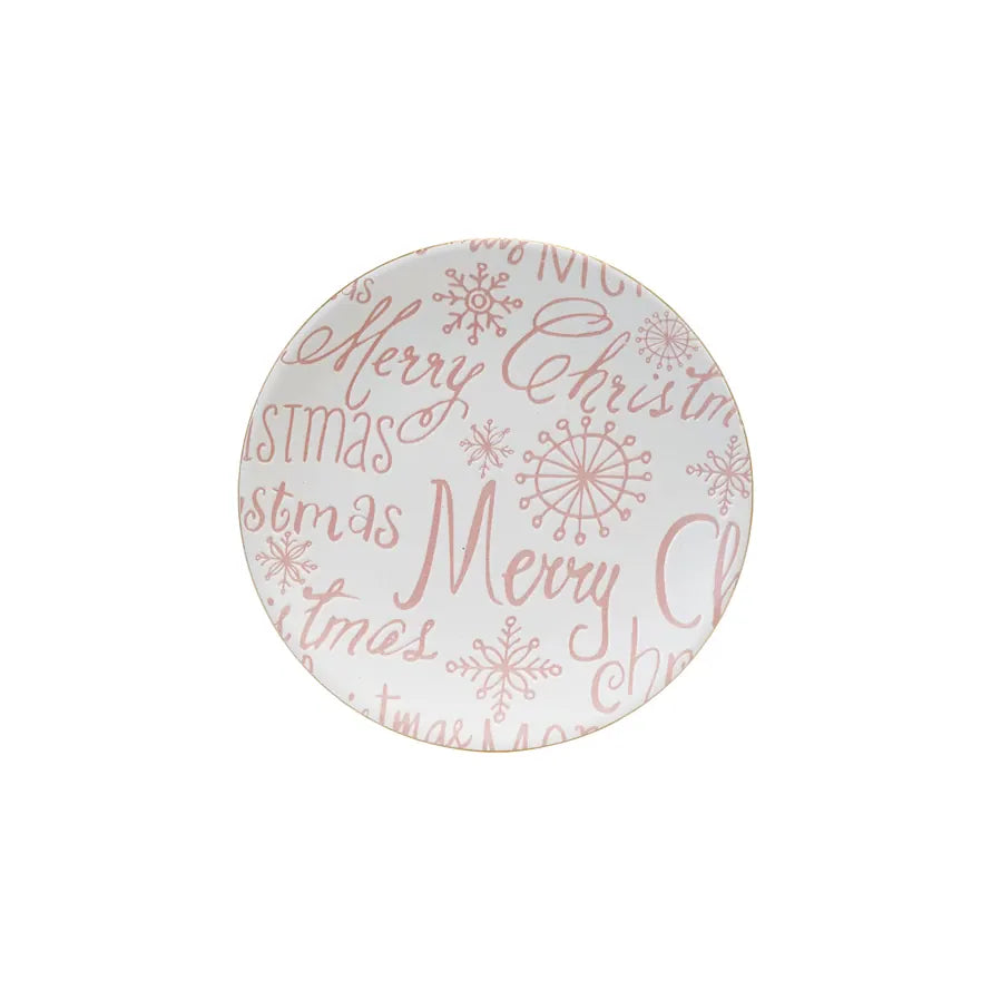 Round ceramic plate with 'Merry Christmas' text and snowflake patterns on a white background