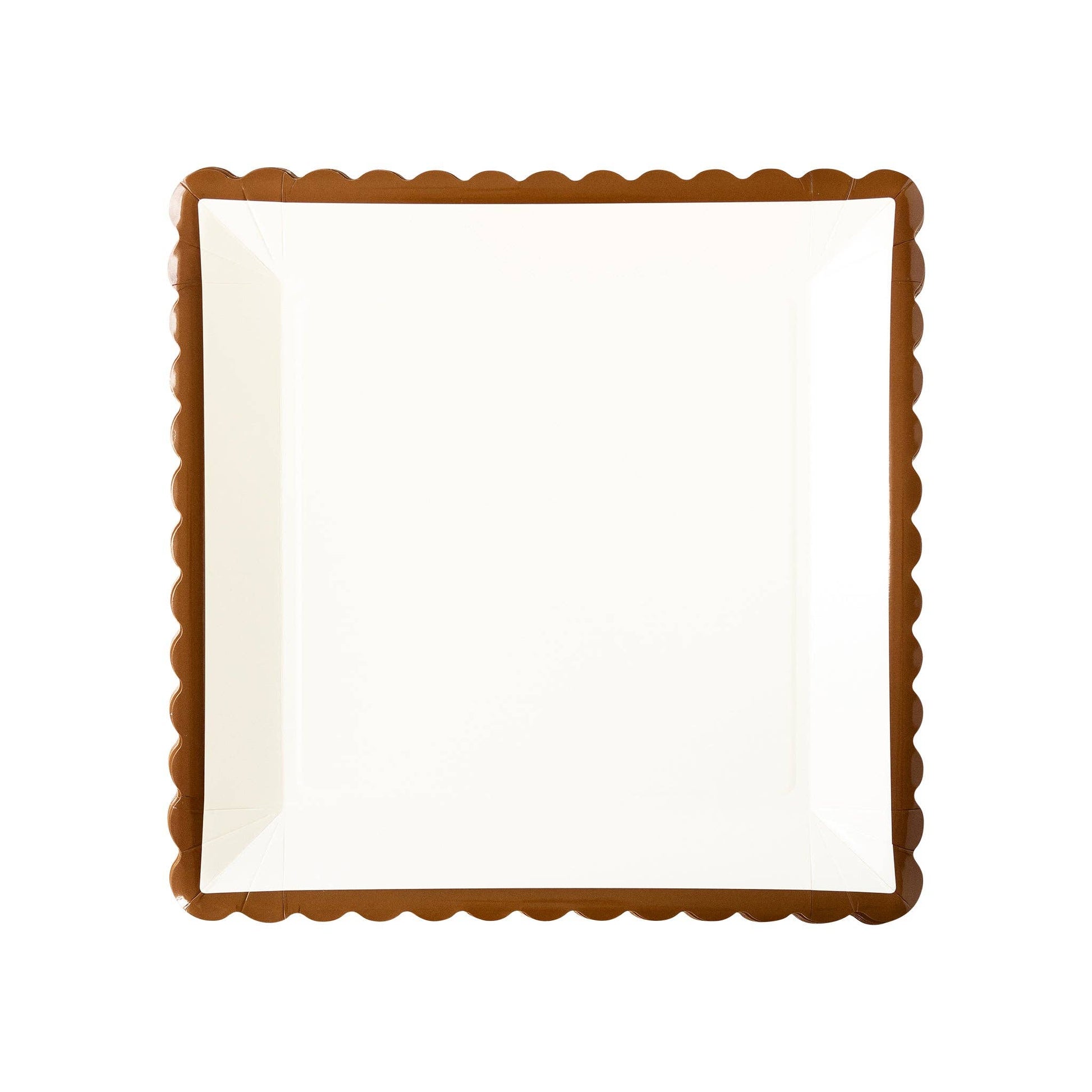 Rectangular white plate with a brown scalloped edge on a white background
