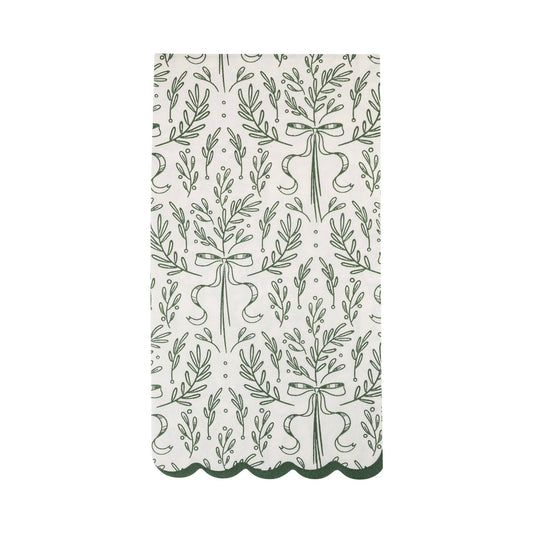 Patterned fabric with green leaves and ribbons on a white background