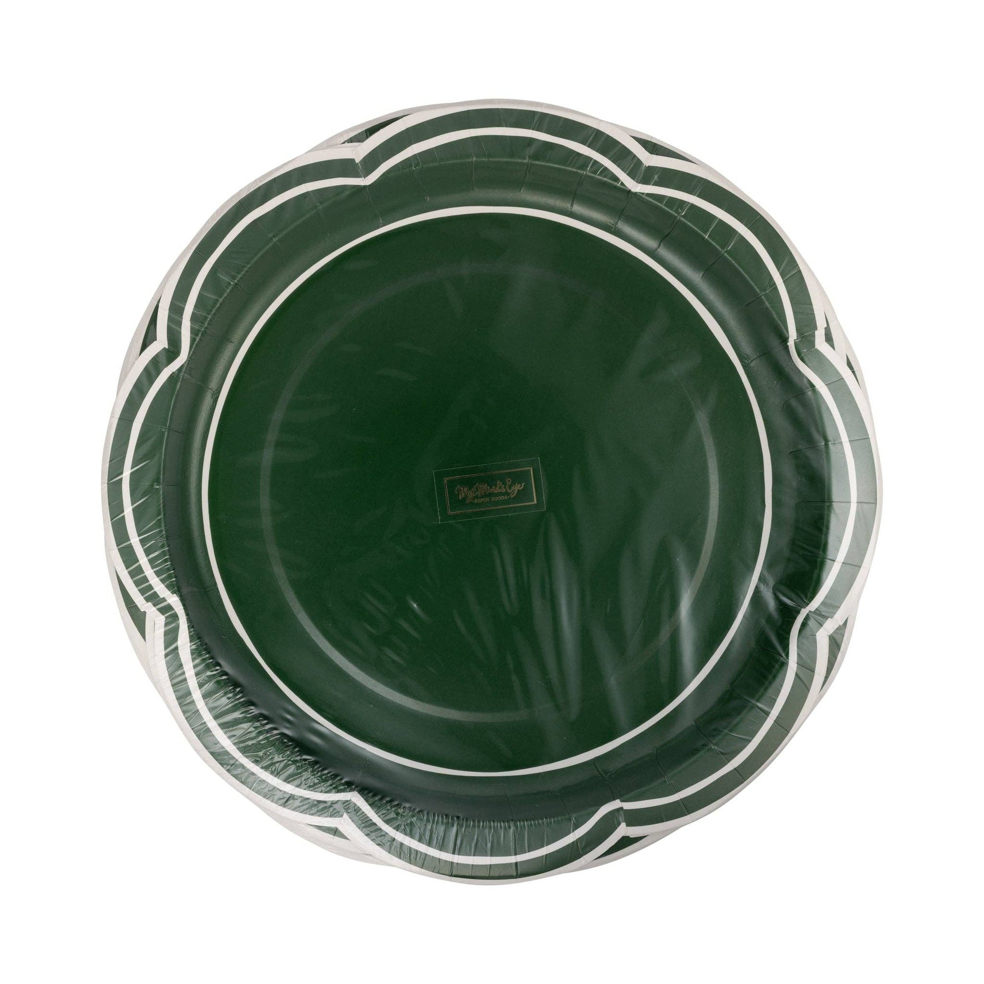 Green plastic plate with decorative rim on a white background