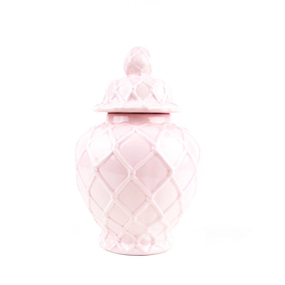 Pink ceramic jar with a lid on a white background