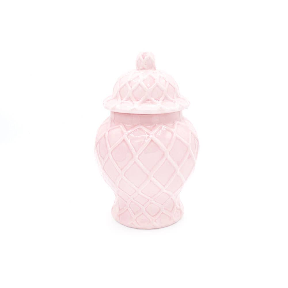 Pink textured jar with a lid on a white background