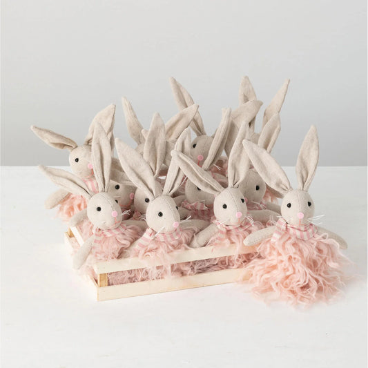 A set of plush white bunny rabbit ornaments with pink bows, arranged in a row on a light background.