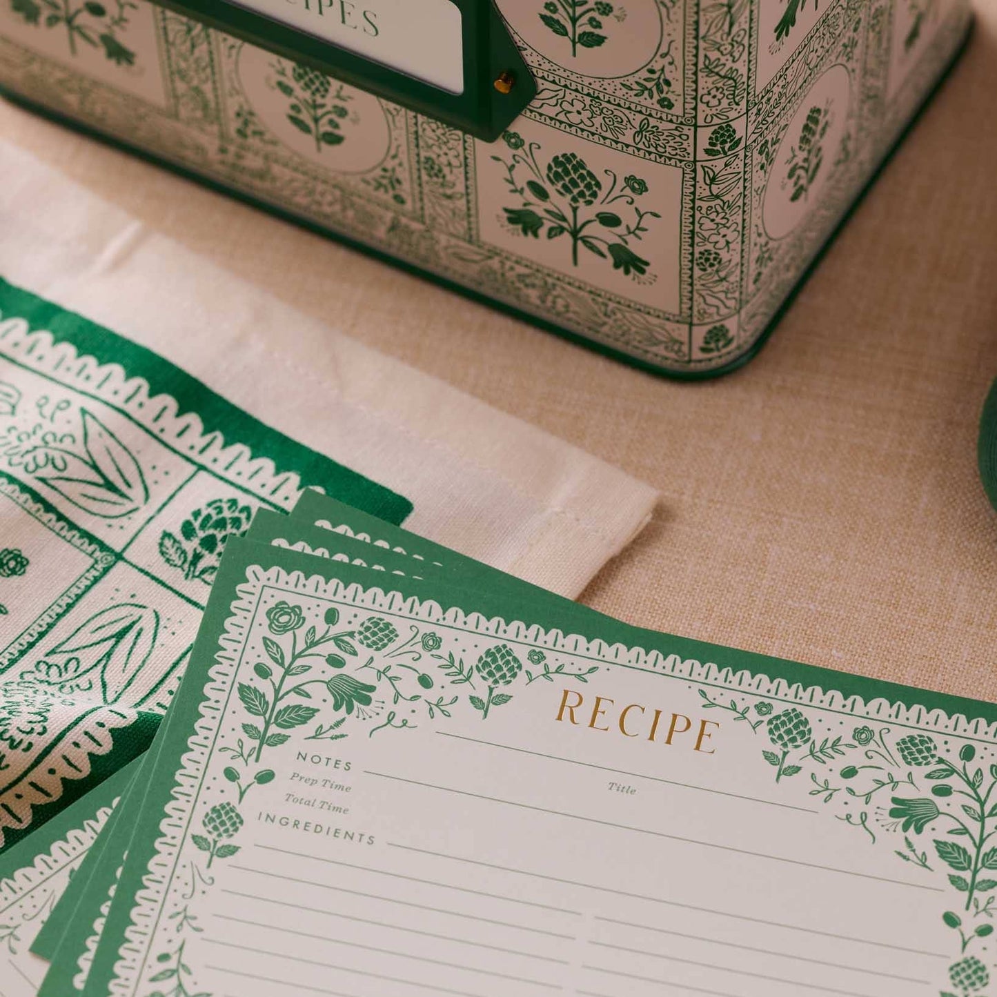 Set of recipe cards with green floral design on a beige  Rifle Paper Co. Artichoke Recipe Cards – Set of 12