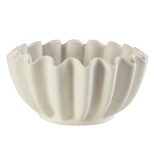 A white ceramic bowl with a scalloped edge design.