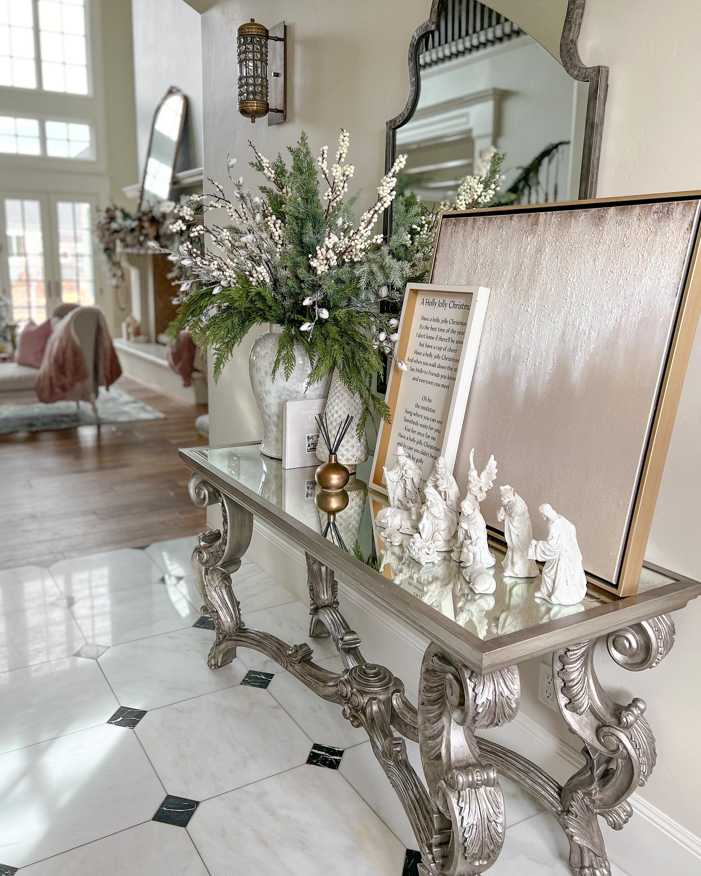 Decorative table with a small nativity scene in a living room.