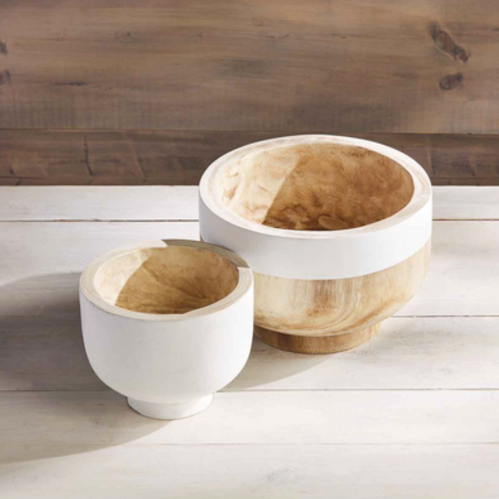 Two hand-painted paulownia wood bowls, one large and one small, with white and natural coloring, displayed on a wooden surface.