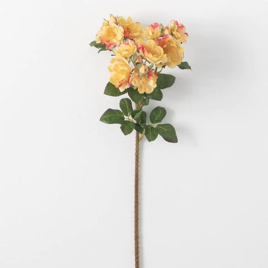 A single artificial yellow rose stem with green leaves against a white background.