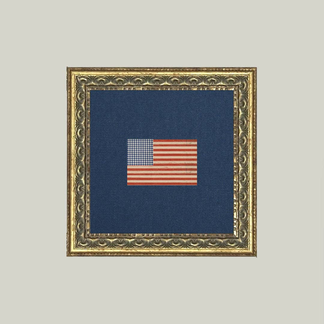 Framed textile patriotic artwork with a small American flag on a blue background Gingham Flag Framed Antique Art 