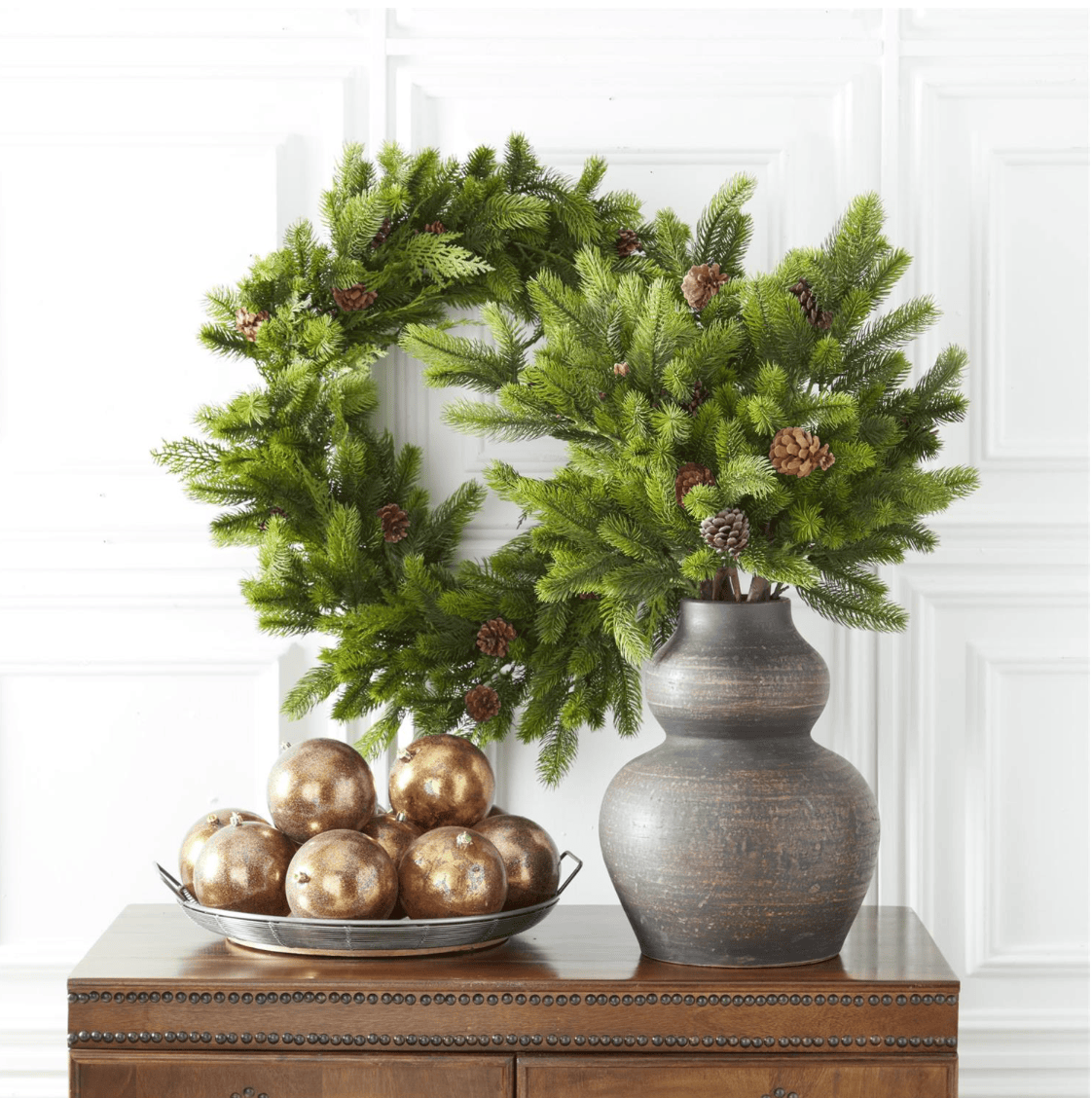 A 40-inch artificial fir and cypress pine branch with pinecones, ideal for holiday and home decor.