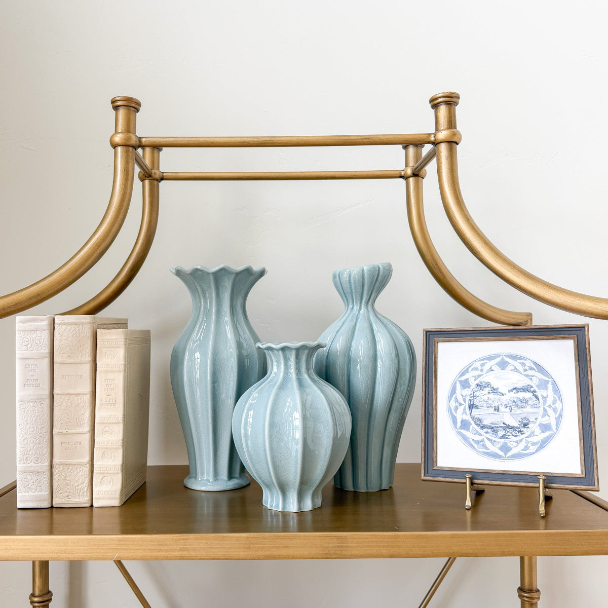 Three light blue fluted ceramic vases 
