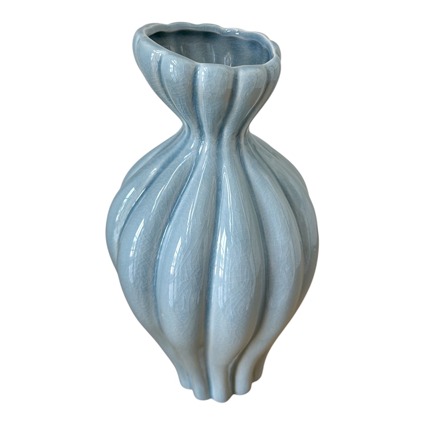 Blue ceramic vase with ribbed texture on a white background