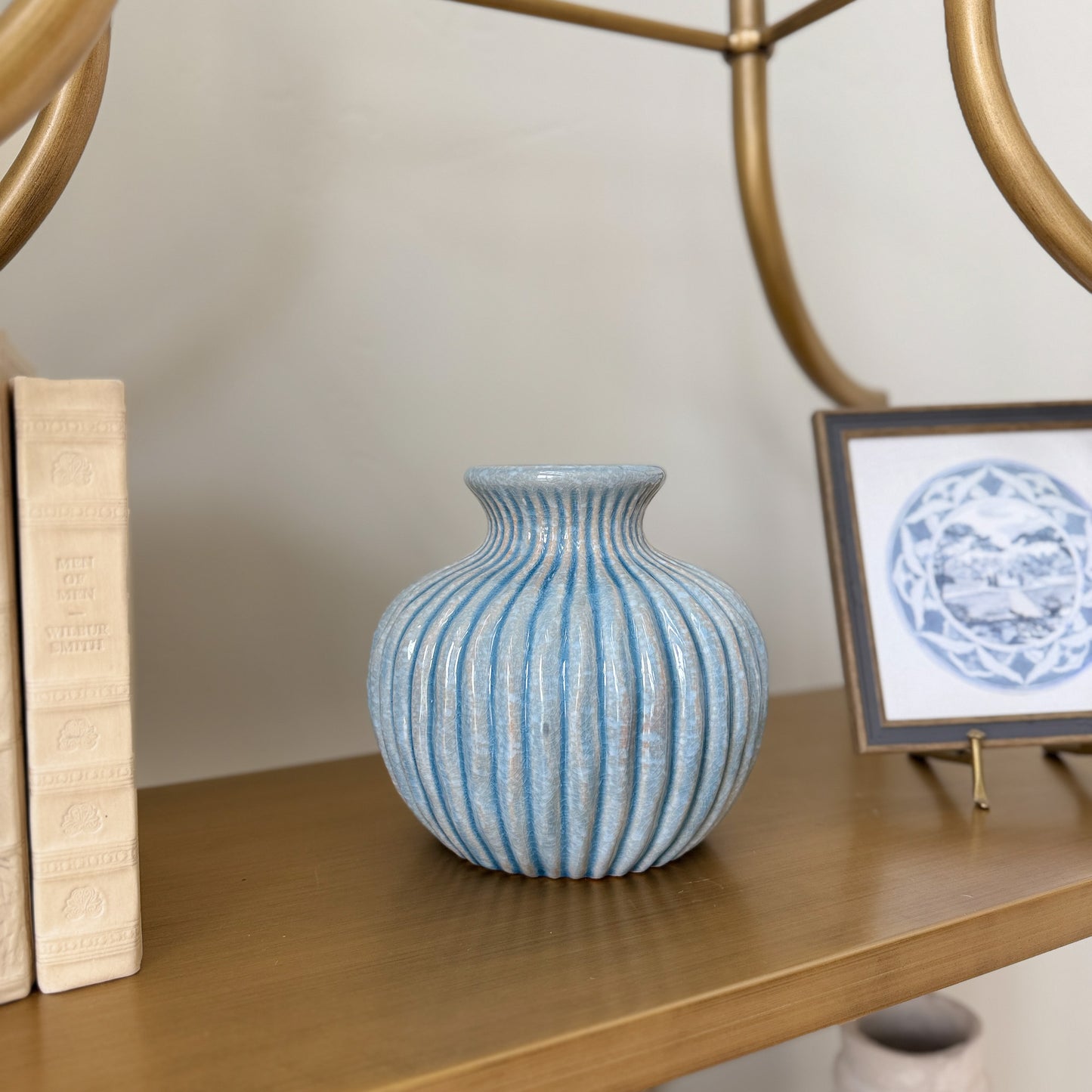 blue ribber flted 7.75 vase on a shelf
