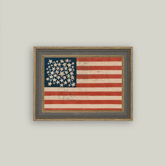 Framed American flag on a plain wall