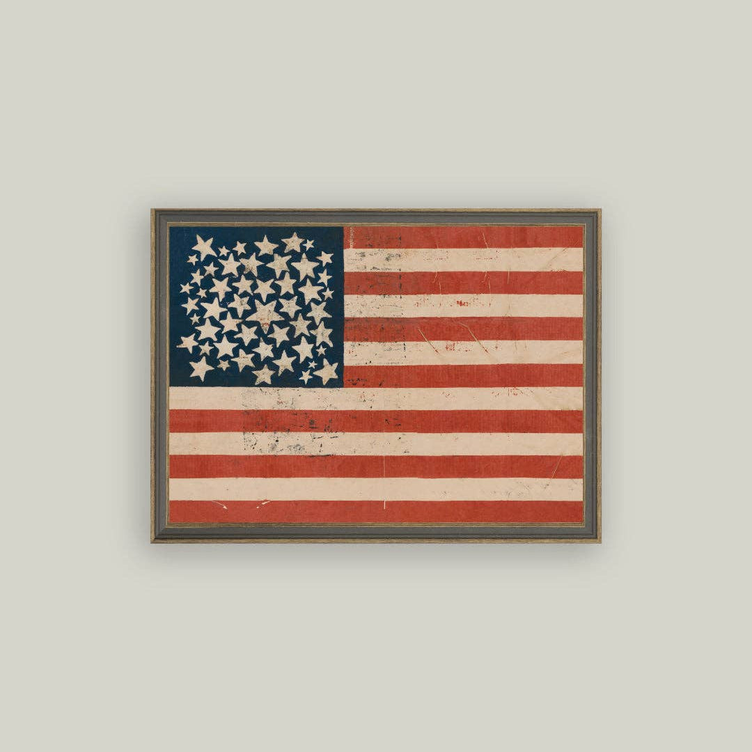 Framed vintage-style American flag on a light gray background